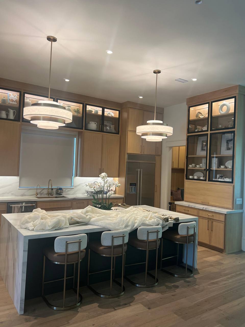 Finished luxury kitchen with custom cabinets and waterfall island
